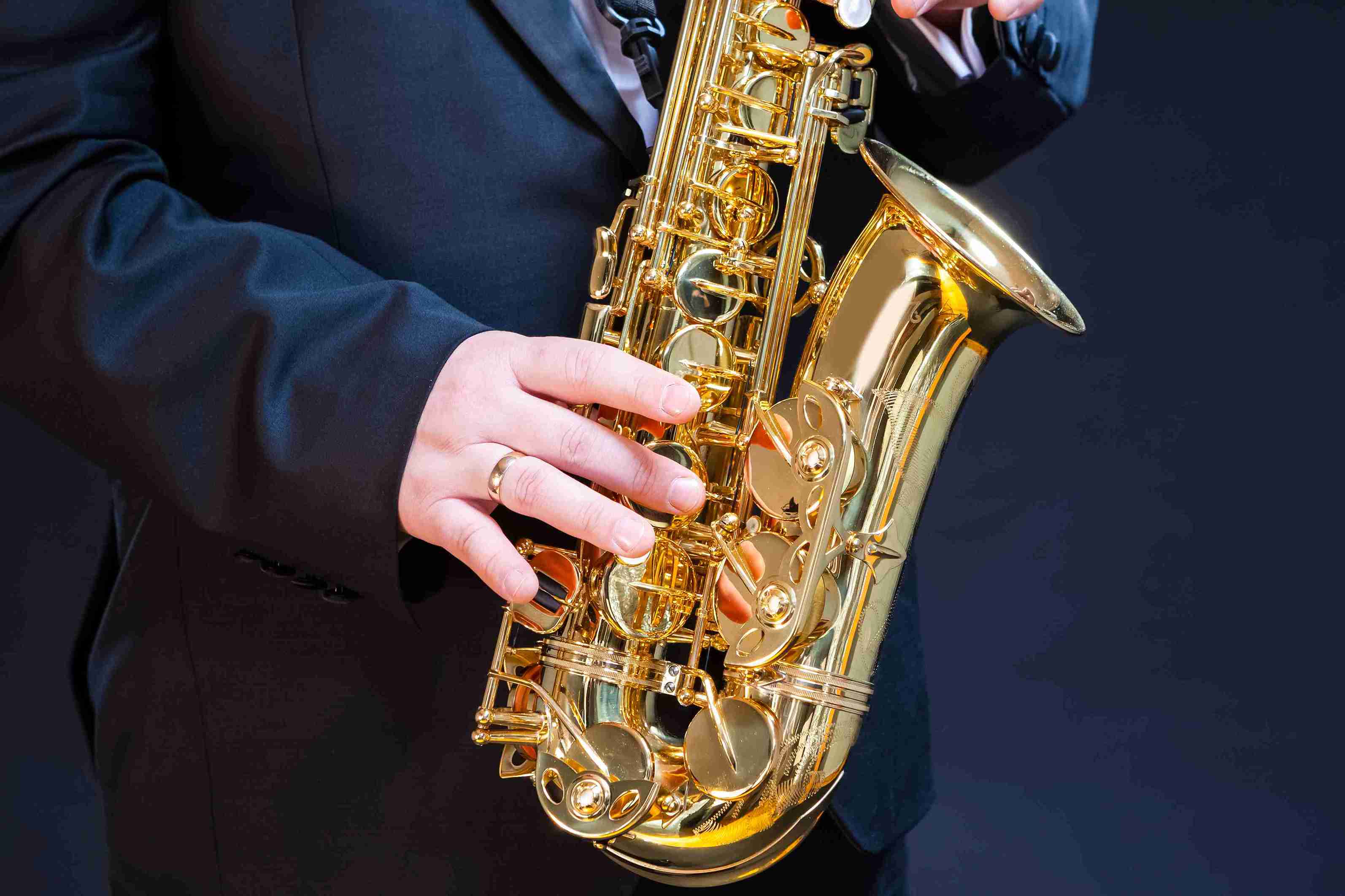 Person playing the saxophone at the annual Savannah Jazz Festival